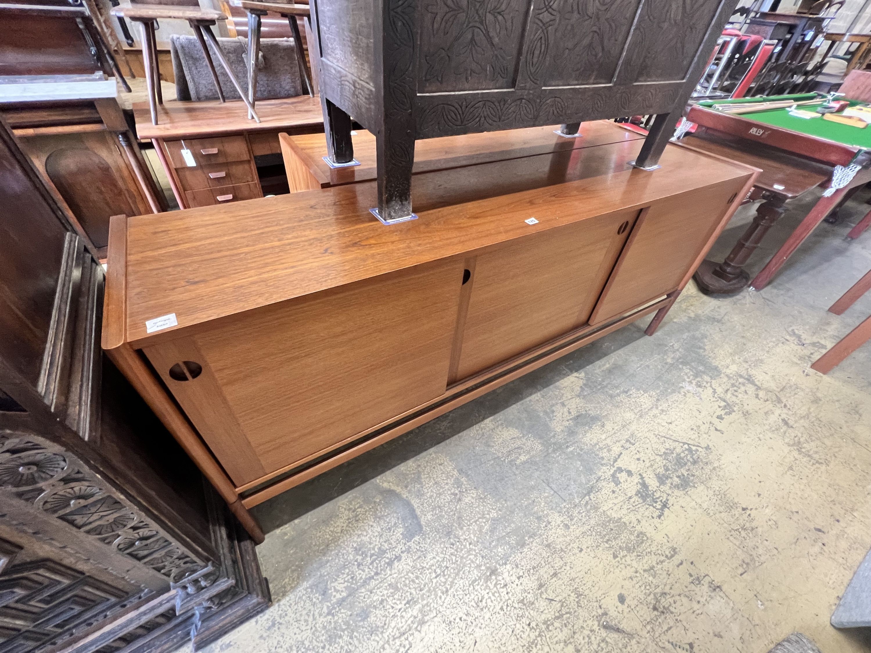 A 1950's Danish teak tambour sideboard, width 200cm depth 46cm height 86cm